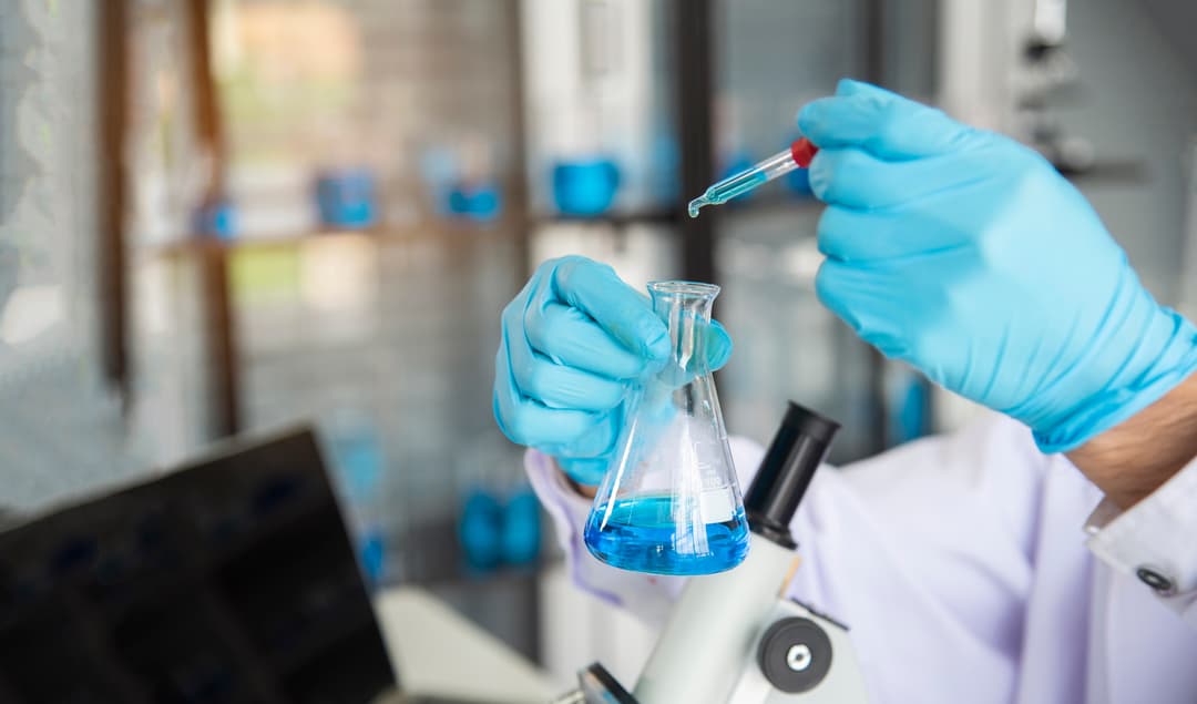 scientist mixing chemical compounds stock image