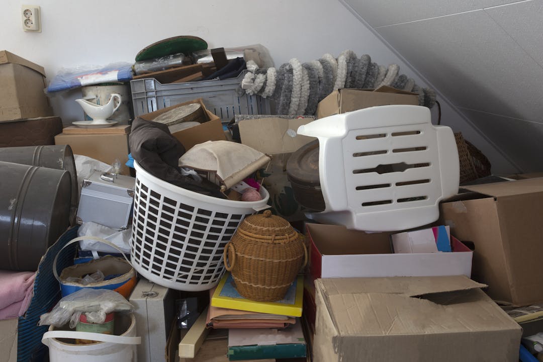 Pile of junk in a house, hoarder room pile of household equipment needs clearing out stock photo