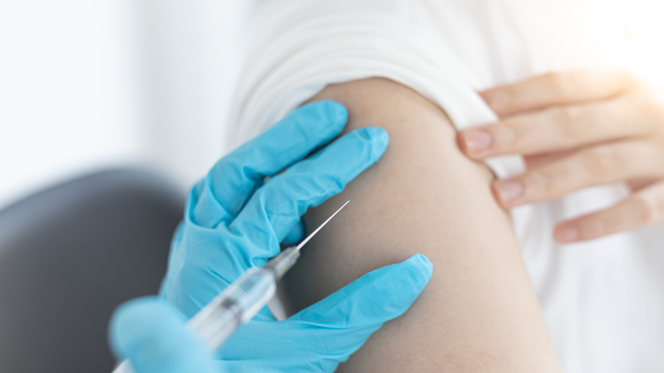 Person receiving a vaccine stock photo