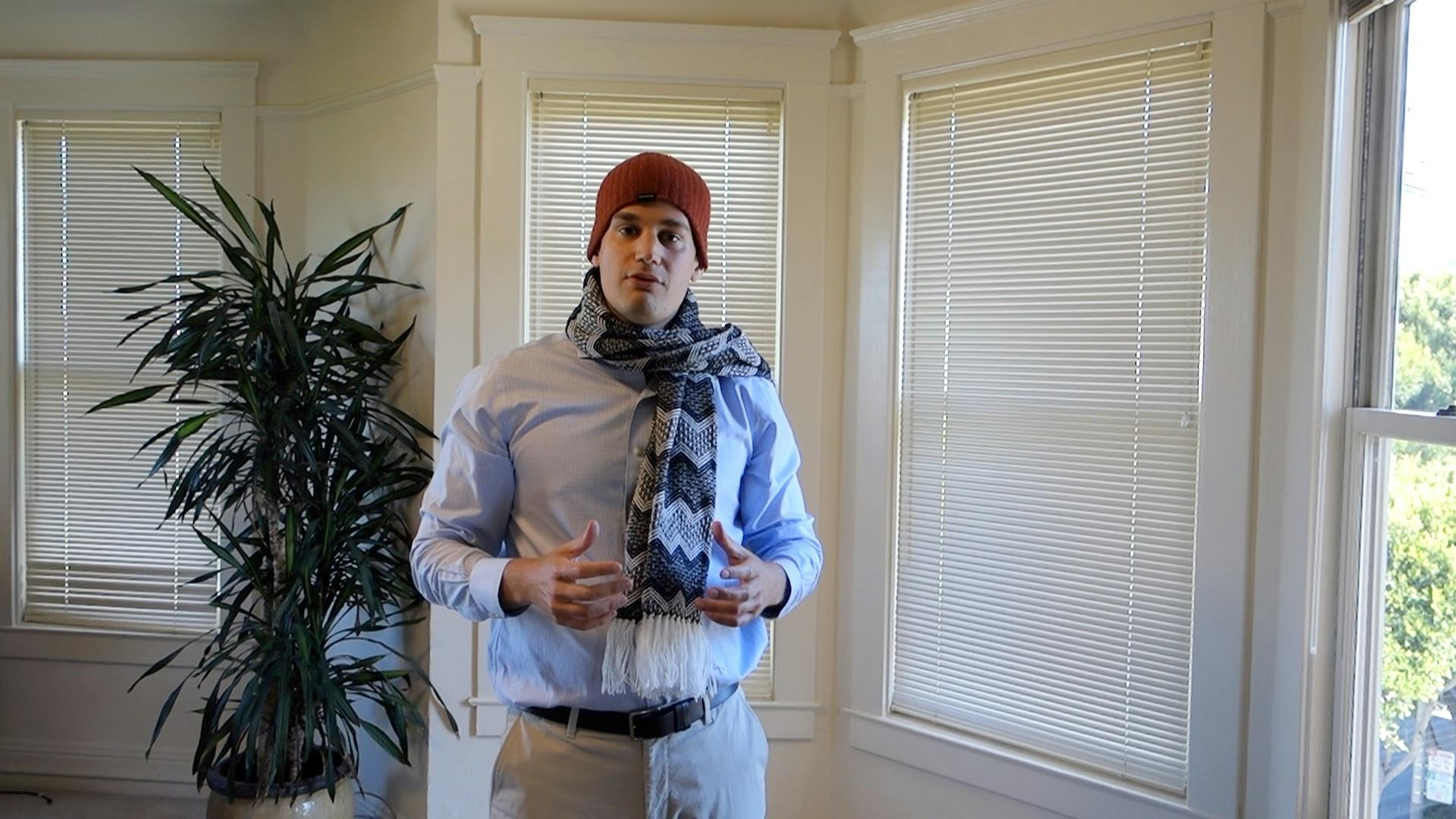 Daniel Petkevich demonstrates Medicare coverage by using a scarf and hat as a metaphor