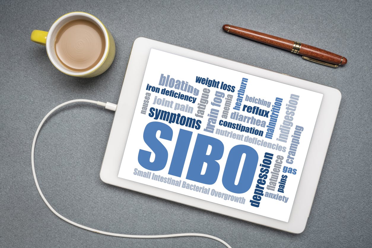 SIBO (small intestinal bacterial overgrowth) symptoms stock photo