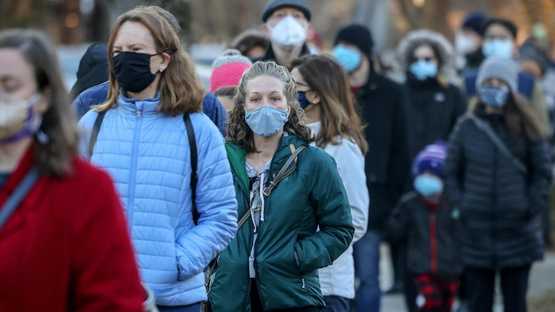 various people wearing masks due to the COVID-19 pandemic stock photo