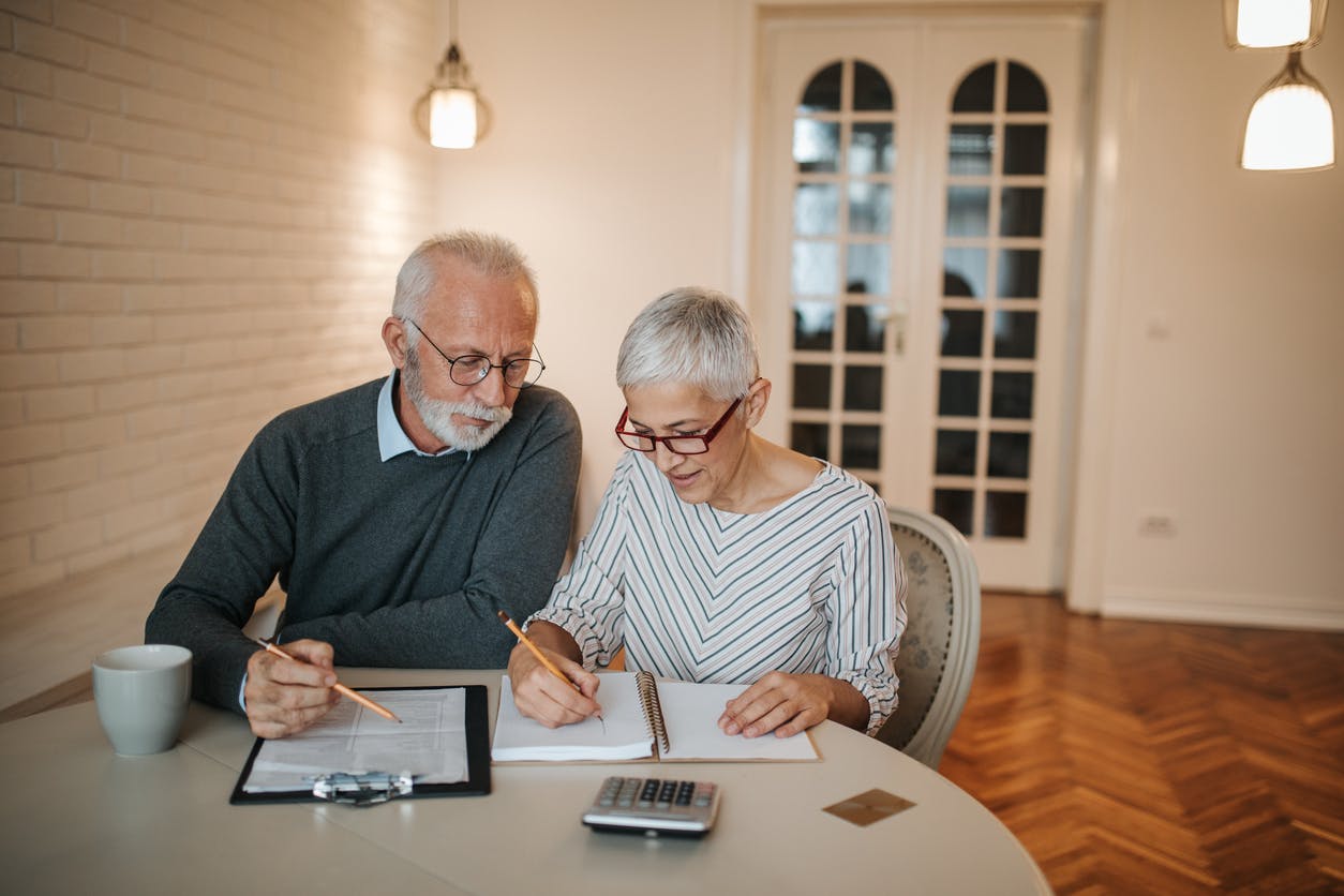 Senior couple going over their finances stock photo