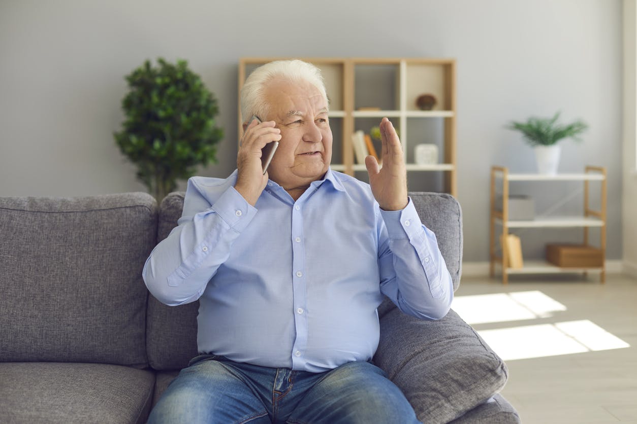 senior man on a phone call stock image