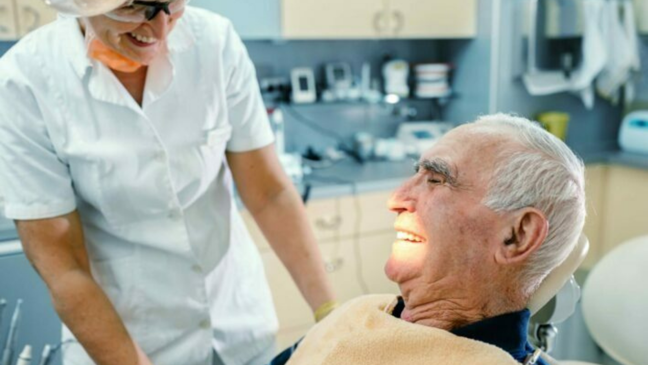 senior man receiving dental care stock photo